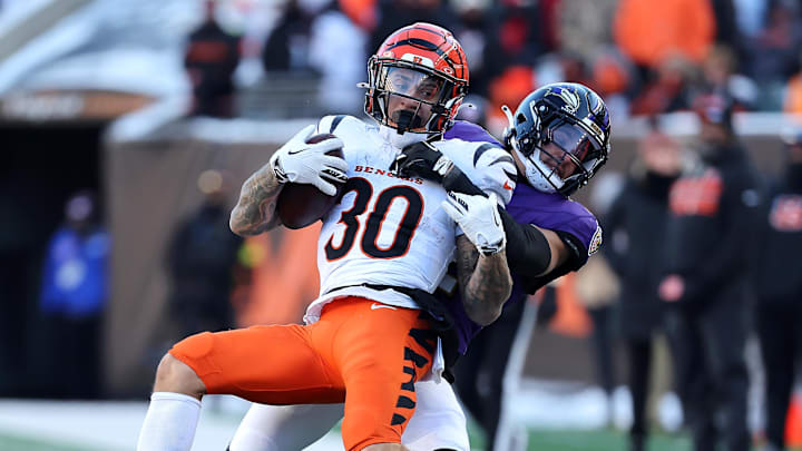 Dec 14, 2025; Cincinnati, Ohio, USA; Cincinnati Bengals running back Chase Brown (30) is tackled by Baltimore Ravens safety Alohi Gilman (12) during the third quarter at Paycor Stadium. Mandatory Credit: Joseph Maiorana-Imagn Images Dec 14, 2025; Cincinnati, Ohio, USA; Cincinnati Bengals running back Chase Brown (30) is tackled by Baltimore Ravens safety Alohi Gilman (12) during the third quarter at Paycor Stadium. Mandatory Credit: Joseph Maiorana-Imagn Images