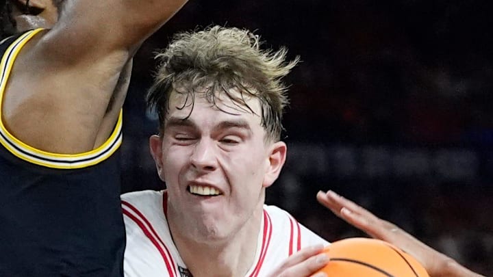 Michigan forward Morez Johnson Jr. (21) guards Arizona center Motiejus Krivas (13) in the first half of their Final Four game at Lucas Oil Stadium in Indianapolis on Saturday, April 4, 2026.