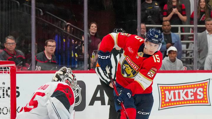 Sep 22, 2026; Raleigh, North Carolina, USA; Carolina Hurricanes goalie Cayden Primeau (55) stops the shot by Florida Panthers center Anton Lundell (15) during the overtime at Lenovo Center. Mandatory Credit: James Guillory-Imagn Images Sep 22, 2026; Raleigh, North Carolina, USA; Carolina Hurricanes goalie Cayden Primeau (55) stops the shot by Florida Panthers center Anton Lundell (15) during the overtime at Lenovo Center. Mandatory Credit: James Guillory-Imagn Images