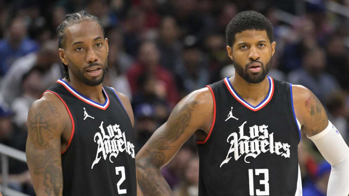 Feb 10, 2024; Los Angeles, California, USA;   Los Angeles Clippers forward Kawhi Leonard (2) and forward Paul George (13) look on in the second half against the Detroit Pistons at Crypto.com Arena. Mandatory Credit: Jayne Kamin-Oncea-USA TODAY Sports