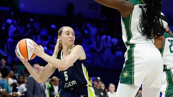 Aug 22, 2025; Arlington, Texas, USA; Dallas Wings guard Paige Bueckers (5) looks to pass against the Seattle Storm during the second half at College Park Center. Mandatory Credit: Chris Jones-Imagn Images
