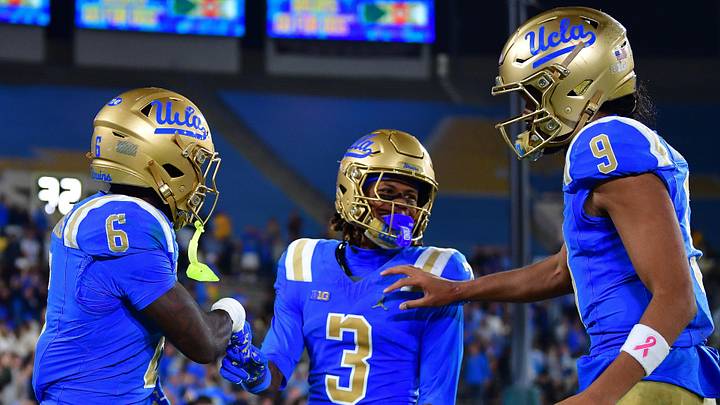 Nov 8, 2025; Pasadena, California, USA; UCLA Bruins running back Anthony Woods (6) celebrates his touchdown scored against the Nebraska Cornhuskers with wide receiver Kwazi Gilmer (3) and quarterback Nico Iamaleava (9) during the second half at the Rose Bowl. Mandatory Credit: Gary A. Vasquez-Imagn Images Nov 8, 2025; Pasadena, California, USA; UCLA Bruins running back Anthony Woods (6) celebrates his touchdown scored against the Nebraska Cornhuskers with wide receiver Kwazi Gilmer (3) and quarterback Nico Iamaleava (9) during the second half at the Rose Bowl. Mandatory Credit: Gary A. Vasquez-Imagn Images