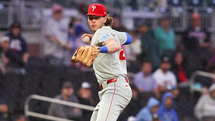 Apr 10, 2025; Atlanta, Georgia, USA; Philadelphia Phillies third baseman Alec Bohm (28) throws a runner out at first against the Atlanta Braves in the second inning at Truist Park. 