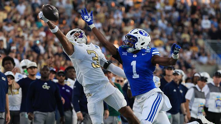 Dec 27, 2025; Orlando, FL, USA; BYU Cougars cornerback Therrian Alexander III (1) defends Georgia Tech Yellow Jackets wide receiver Eric Rivers (3) during the first half at Camping World Stadium. Mandatory Credit: Kim Klement Neitzel-Imagn Images