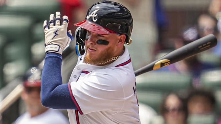 Apr 20, 2025; Cumberland, Georgia, USA; Atlanta Braves left fielder Alex Verdugo (8) singles against the Minnesota Twins during the second inning at Truist Park