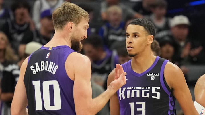 Mar 10, 2024; Sacramento, California, USA; Sacramento Kings forward Domantas Sabonis (10) talks with forward Keegan Murray (13) during the third quarter against the Houston Rockets at Golden 1 Center.