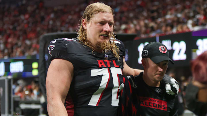 Sep 22, 2024; Atlanta, Georgia, USA; Atlanta Falcons offensive tackle Kaleb McGary (76) leaves the field with an injury against the Kansas City Chiefs in the second quarter at Mercedes-Benz Stadium. Mandatory Credit: Brett Davis-Imagn Images
