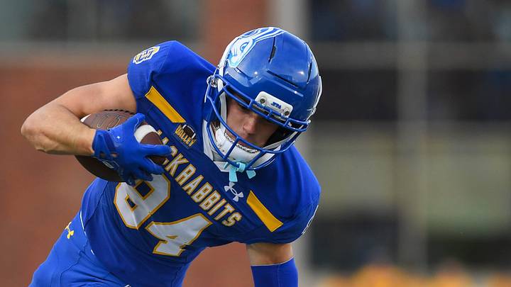 South Dakota State Jackrabbits wide receiver Alex Bullock (84) runs with the ball while evading Sacramento State Hornets running back Damian Henderson II (4) on Saturday, Aug. 30, 2025, at Dana J. Dykhouse Stadium in Brookings, South Dakota.