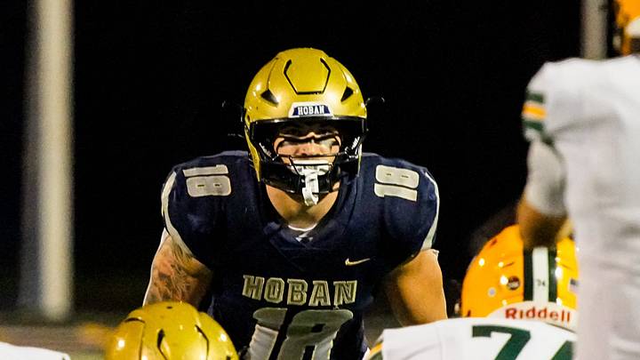 Hoban’s Brayton Feister (18) eyes the St. Edward offensive line, Oct. 24, 2025. Hoban’s Brayton Feister (18) eyes the St. Edward offensive line, Oct. 24, 2025.