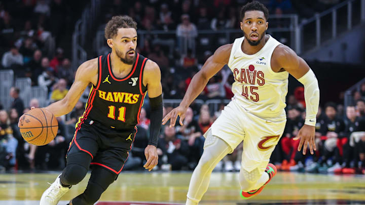 Nov 29, 2024; Atlanta, Georgia, USA; Atlanta Hawks guard Trae Young (11) dribbles the ball past Cleveland Cavaliers guard Donovan Mitchell (45) during the first quarter at State Farm Arena. Mandatory Credit: Jordan Godfree-Imagn Images Nov 29, 2024; Atlanta, Georgia, USA; Atlanta Hawks guard Trae Young (11) dribbles the ball past Cleveland Cavaliers guard Donovan Mitchell (45) during the first quarter at State Farm Arena. Mandatory Credit: Jordan Godfree-Imagn Images