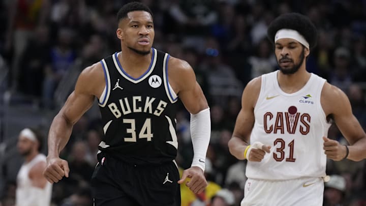 Mar 9, 2025; Milwaukee, Wisconsin, USA;  Milwaukee Bucks forward Giannis Antetokounmpo (34) runs down the court after making a basket against Cleveland Cavaliers center Jarrett Allen (31) in the first half at Fiserv Forum. Mandatory Credit: Michael McLoone-Imagn Images