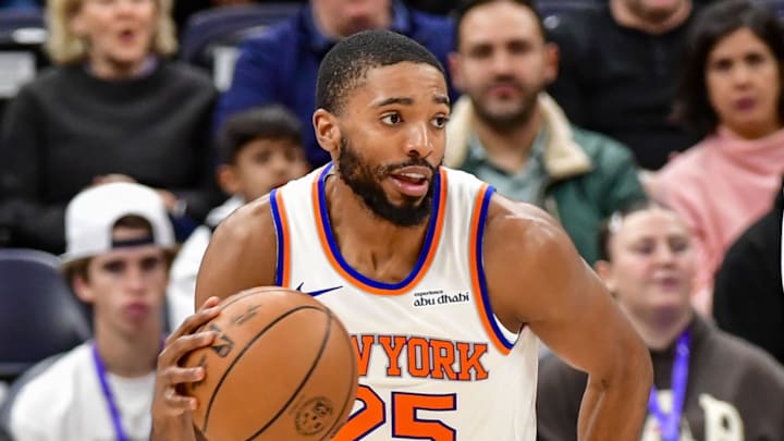 New York Knicks guard/forward Mikal Bridges dribbles the ball downcourt against the Utah Jazz.