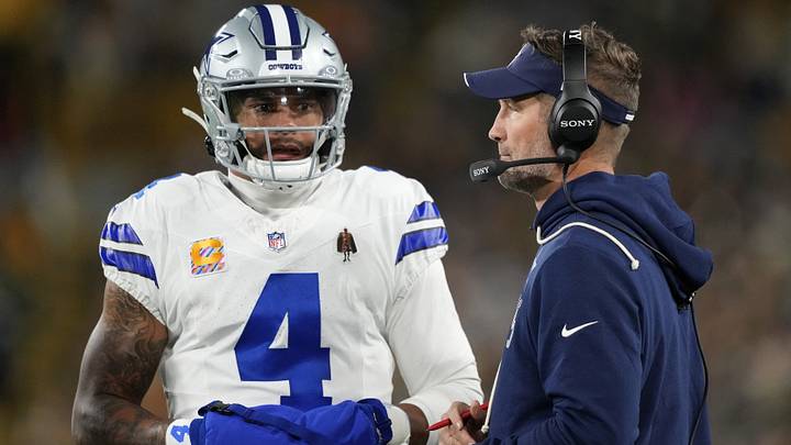 Dallas Cowboys QB Dak Prescott talks with head coach Brian Schottenheimer during the game against the Green Bay Packers. Dallas Cowboys QB Dak Prescott talks with head coach Brian Schottenheimer during the game against the Green Bay Packers.