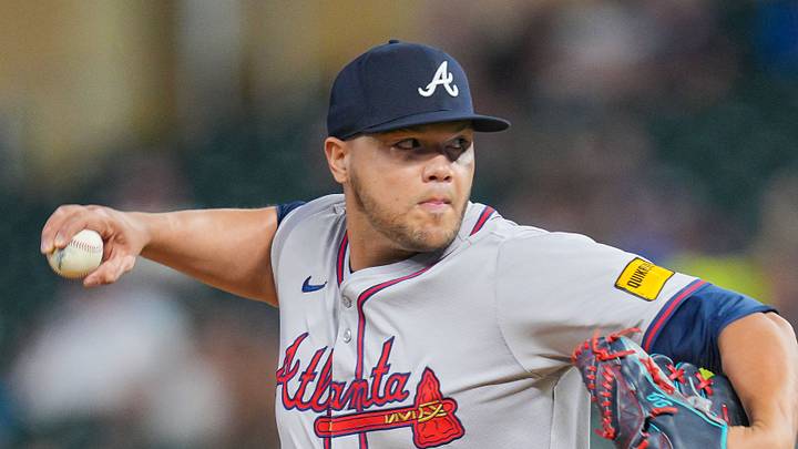 Aug 27, 2024; Minneapolis, Minnesota, USA; Atlanta Braves pitcher Joe Jiménez (77) pitches against the Minnesota Twins in the seventh inning at Target Field. Mandatory Credit: Brad Rempel-USA TODAY Sports