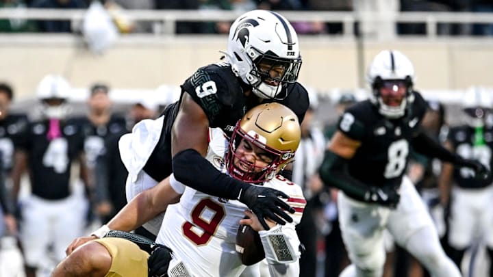 Michigan State's Anelu Lafaele, bottom, and Jalen Thompson, top, tackle Boston College's Dylan Lonergan during the first quarter on Saturday, Sept. 6, 2025, at Spartan Stadium in East Lansing.