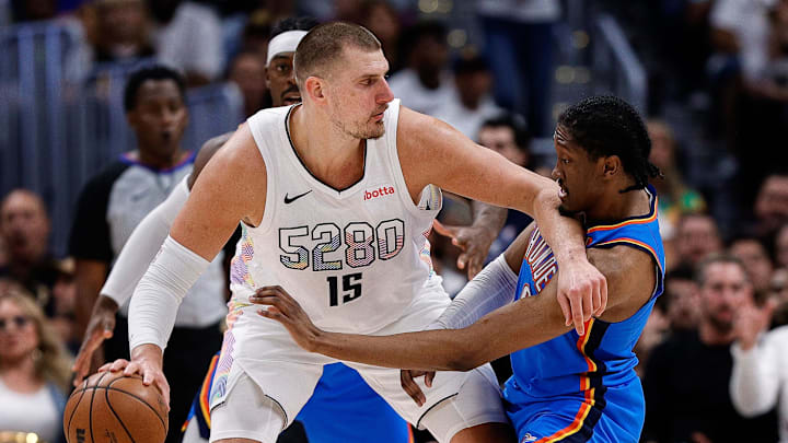 May 15, 2025; Denver, Colorado, USA; Denver Nuggets center Nikola Jokic (15) controls the ball as Oklahoma City Thunder forward Jalen Williams (8) guards in the second quarter during game six of the second round for the 2025 NBA Playoffs at Ball Arena.