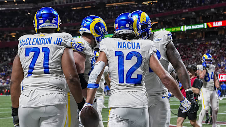 Dec 29, 2025; Atlanta, Georgia, USA; Los Angeles Rams wide receiver Puka Nacua (12) reacts after scoring a touchdown against the Atlanta Falcons during the second half at Mercedes-Benz Stadium. Mandatory Credit: Dale Zanine-Imagn Images