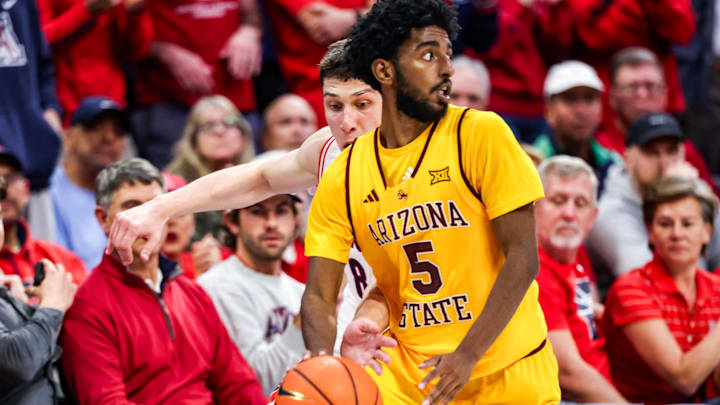 Jan 14, 2026; Tucson, Arizona, USA; Arizona Wildcats forward Ivan Kharchenkov (8) attempts to steal the ball from Arizona State Sun Devils guard Moe Odum (5) during the second half of the game at McKale Memorial Center. Mandatory Credit: Aryanna Frank-Imagn Images