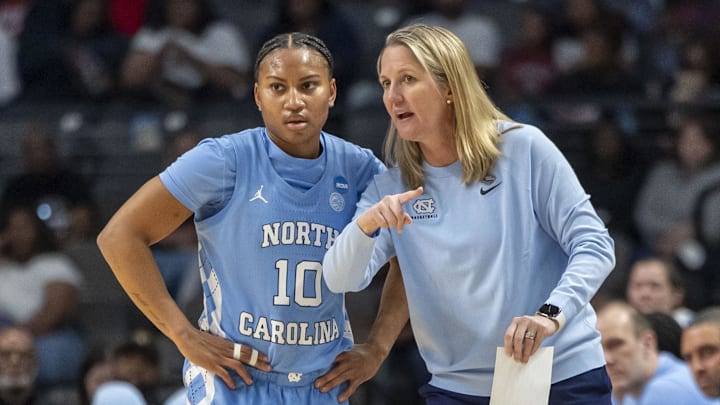 Mar 28, 2025; Birmingham, AL, USA; North Carolina Tar Heels head coach Courtney Banghart works with guard Reniya Kelly (10) during the Sweet 16 NCAA Tournament basketball game against the Duke Blue Devils at Legacy Arena. Mandatory Credit: Vasha Hunt-Imagn Images