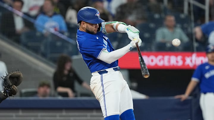 May 13, 2025; Toronto, Ontario, CAN; Toronto Blue Jays shortstop Bo Bichette (11) hits an RBI double against the Tampa Bay Rays during the ninth inning at Rogers Centre. 