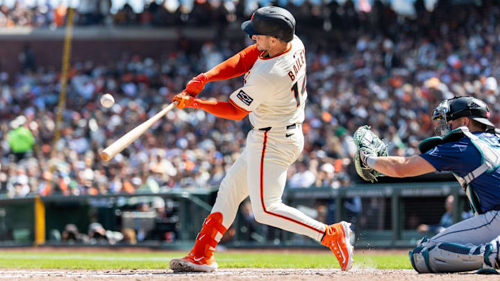 Apr 4, 2025; San Francisco, California, USA; San Francisco Giants catcher Patrick Bailey (14) hits a double during the third inning against the Seattle Mariners at Oracle Park.