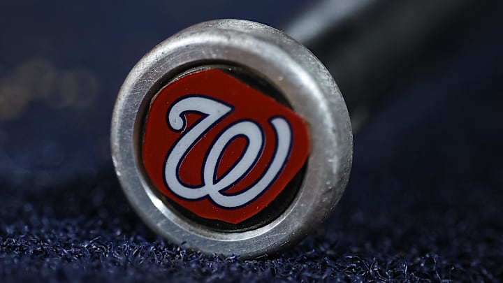 May 12, 2023; Washington, District of Columbia, USA; A detailed view of the Washington Nationals logo on a weighted bat during the seventh inning of the game between the Washington Nationals and the New York Mets at Nationals Park. 