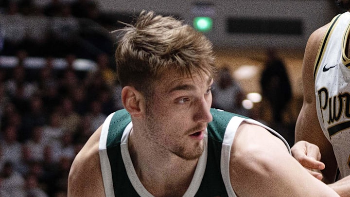 Feb 26, 2026; West Lafayette, Indiana, USA; Michigan State Spartans center Carson Cooper (15) dribbles around Purdue Boilermakers forward Trey Kaufman-Renn (4) during the first half at Mackey Arena.