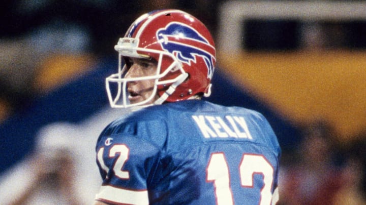 Jan 30, 1994; Atlanta, GA, USA; FILE PHOTO; Buffalo Bills quarterback Jim Kelly (12) looks to pass against the Dallas Cowboys during Super Bowl XXVIII at the Georgia Dome. The Cowboys defeated the Bills 30-13. Mandatory Credit: James D. Smith-Imagn Images