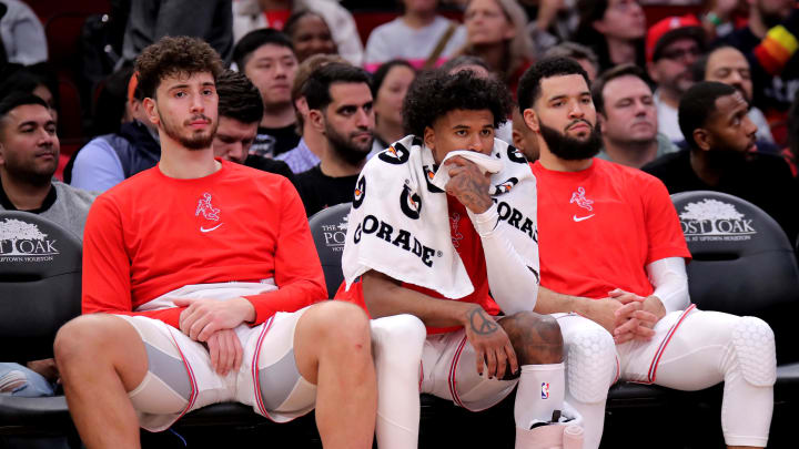 Dec 27, 2023; Houston, Texas, USA; (from L-to-R) Houston Rockets center Alperen Sengun (28), Houston Rockets guard Jalen Green (4) and Houston Rockets guard Fred VanVleet (5) sit on the bench during the fourth quarter against the Phoenix Suns at Toyota Center. Mandatory Credit: Erik Williams-USA TODAY Sports