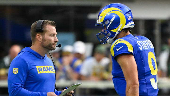 Los Angeles Rams coach Sean McVay talks to quarterback Matthew Stafford on the sidelines.