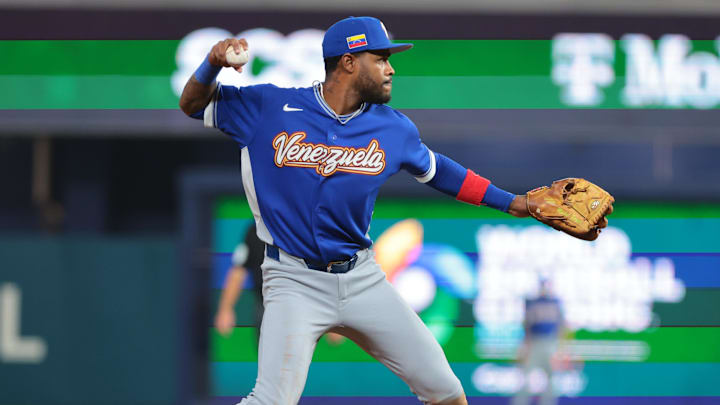 Mar 16, 2026; Miami, FL, United States; Venezuela third baseman Maikel Garcia (11) throws to first base for an out against Italy in the fourth inning during a semifinal game of the 2026 World Baseball Classic at loanDepot Park. Mandatory Credit: Sam Navarro-Imagn Images
