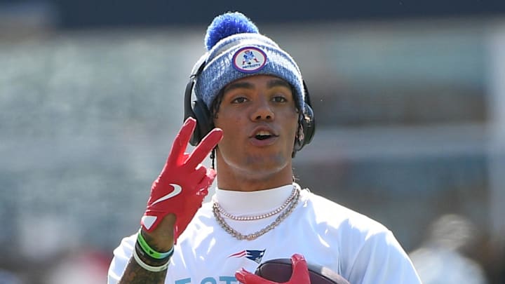 Sep 28, 2025; Foxborough, Massachusetts, USA;  New England Patriots cornerback Christian Gonzalez (0) signals to a teammate during warmups prior to a game against the Carolina Panthers at Gillette Stadium. Mandatory Credit: Bob DeChiara-Imagn Images