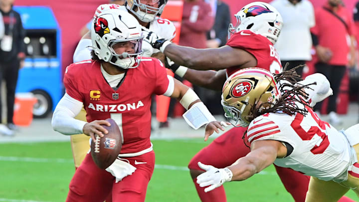 Jan 5, 2025; Glendale, Arizona, USA; Arizona Cardinals quarterback Kyler Murray (1) escapes a tackle by San Francisco 49ers linebacker Fred Warner (54) in the first half at State Farm Stadium. Mandatory Credit: Matt Kartozian-Imagn Images Jan 5, 2025; Glendale, Arizona, USA; Arizona Cardinals quarterback Kyler Murray (1) escapes a tackle by San Francisco 49ers linebacker Fred Warner (54) in the first half at State Farm Stadium. Mandatory Credit: Matt Kartozian-Imagn Images