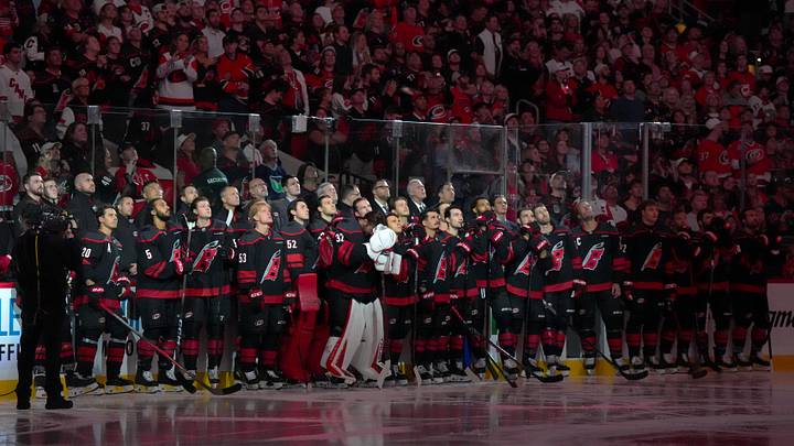 Sep 29, 2026; Raleigh, North Carolina, USA; Carolina Hurricanes players watch the Stanley Cup winners banner being raised to the rafters in a ceremony before a game at Lenovo Center. Mandatory Credit: James Guillory-Imagn Images Sep 29, 2026; Raleigh, North Carolina, USA; Carolina Hurricanes players watch the Stanley Cup winners banner being raised to the rafters in a ceremony before a game at Lenovo Center. Mandatory Credit: James Guillory-Imagn Images