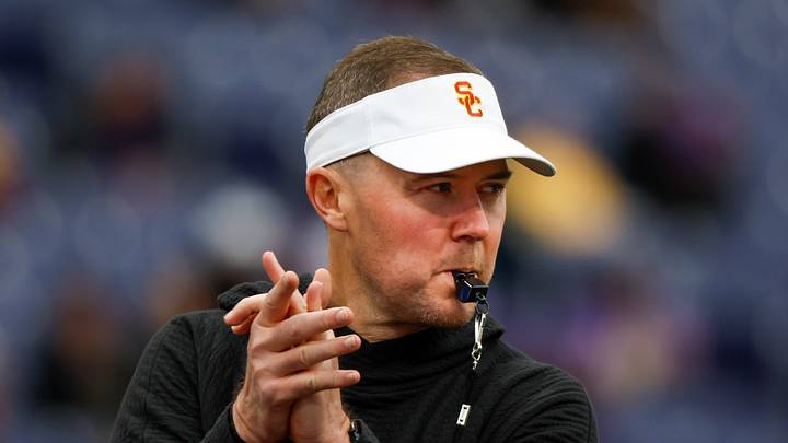 Nov 2, 2024; Seattle, Washington, USA; USC Trojans head coach Lincoln Riley watches pregame warmups against the Washington Huskies at Alaska Airlines Field at Husky Stadium. Nov 2, 2024; Seattle, Washington, USA; USC Trojans head coach Lincoln Riley watches pregame warmups against the Washington Huskies at Alaska Airlines Field at Husky Stadium.