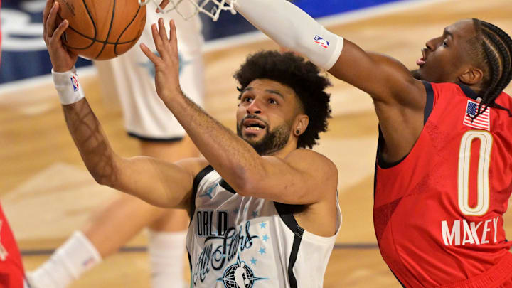 Feb 15, 2026; Inglewood, California, USA; Team World guard Jamal Murray (27) of the Denver Nuggets shoots against Team USA Stars guard Tyrese Maxey (0) of the Philadelphia 76ers in game one during the 75th NBA All Star Game at Intuit Dome.