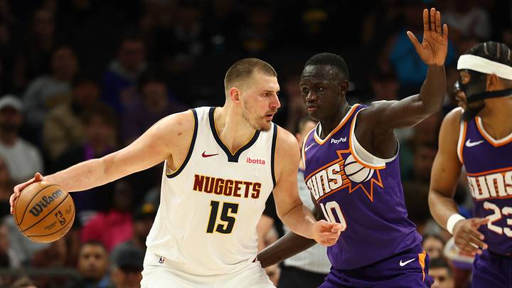 Mar 24, 2026; Phoenix, Arizona, USA; Denver Nuggets center Nikola Jokic (15) against Phoenix Suns center Khaman Maluach (10) at Mortgage Matchup Center. Mandatory Credit: Mark J. Rebilas-Imagn Images