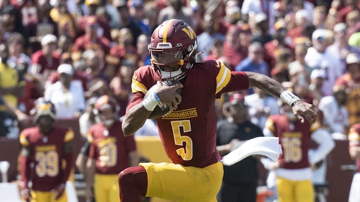 Sep 15, 2024; Landover, Maryland, USA; Washington Commanders quarterback Jayden Daniels (5) runs down the field in the first half against the New York Giants at Commanders Field. Mandatory Credit: Luke Johnson-Imagn Images

