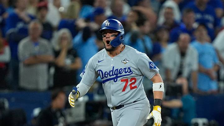 Nov 1, 2025; Toronto, Ontario, CAN; Los Angeles Dodgers second baseman Miguel Rojas (72) celebrates as he runs the bases after hitting a home run against the Toronto Blue Jays in the ninth inning during game seven of the 2025 MLB World Series at Rogers Centre. Mandatory Credit: John E. Sokolowski-Imagn Images