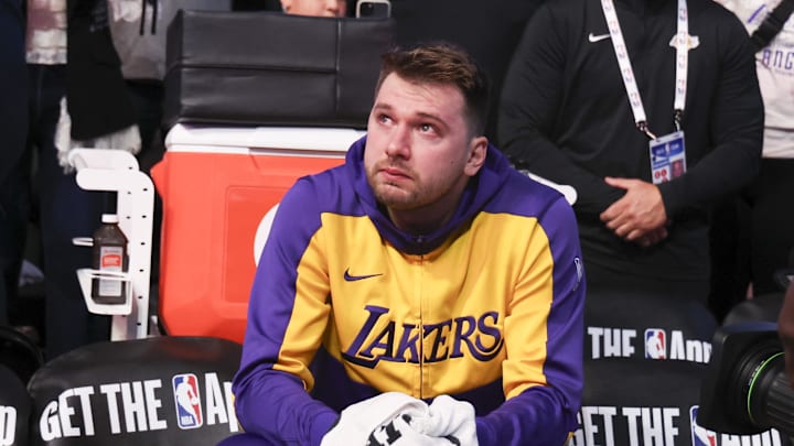 Apr 9, 2025; Dallas, Texas, USA;  Los Angeles Lakers guard Luka Doncic (77) reacts while watching a tribute video before the game against the Dallas Mavericks at American Airlines Center. Mandatory Credit: Kevin Jairaj-Imagn Images
