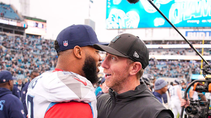 Tennessee Titans defensive tackle Jeffery Simmons (98) gives Jacksonville Jaguars head coach Liam Coen a hug after the game at EverBank Stadium, Sunday, Jan. 4, 2026, in Jacksonville, Fla. The Jaguars defeated the Titans 41-7 [Doug Engle/Florida Times-Union]