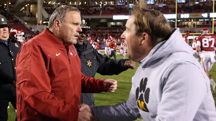 Arkansas Razorbacks coach Sam Pittman shakes hands with Missouri Tigers coach Eil Drinkwitz after the game at Razorback Stadium. Arkansas won 34-17. Arkansas Razorbacks coach Sam Pittman shakes hands with Missouri Tigers coach Eil Drinkwitz after the game at Razorback Stadium. Arkansas won 34-17.