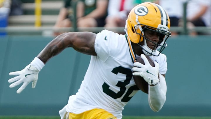 Green Bay Packers running back MarShawn Lloyd (32) runs through a drill during the second day of training camp on Thursday, July 24, 2025, at Ray Nitschke Field in Ashwaubenon, Wis.