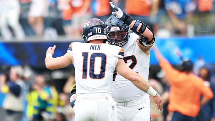 Sep 21, 2025; Inglewood, California, USA; Denver Broncos offensive tackle Garett Bolles (72) and Denver Broncos quarterback Bo Nix (10) react after a play during the first half against the Los Angeles Chargers at SoFi Stadium. 