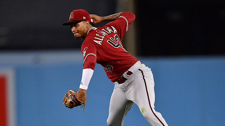 Sep 20, 2022; Los Angeles, California, USA; Arizona Diamondbacks shortstop Sergio Alcantara (43) throws to first for the out against Los Angeles Dodgers third baseman Justin Turner (10) during the sixth inning at Dodger Stadium. Mandatory Credit: Gary A. Vasquez-Imagn Images