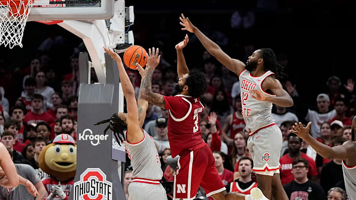 Ohio State forward Devin Royal (left) and guard Evan Mahaffey defend against Nebraska guard Brice Williams during the second overtime Tuesday night. Ohio State forward Devin Royal (left) and guard Evan Mahaffey defend against Nebraska guard Brice Williams during the second overtime Tuesday night.
