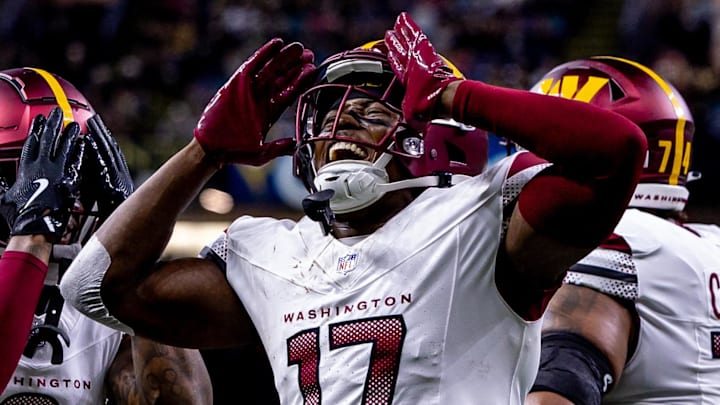 Dec 15, 2024; New Orleans, Louisiana, USA;  Washington Commanders wide receiver Terry McLaurin (17) reacts to scoring a touchdown against the New Orleans Saints during the first half at Caesars Superdome. Mandatory Credit: Stephen Lew-Imagn Images