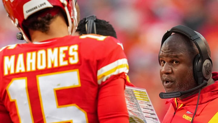 Oct 16, 2022; Kansas City, Missouri, USA; Kansas City Chiefs offensive coordinator Eric Bieniemy talks with quarterback Patrick Mahomes (15) during the second half against the Buffalo Bills at GEHA Field at Arrowhead Stadium. Mandatory Credit: Jay Biggerstaff-Imagn Images