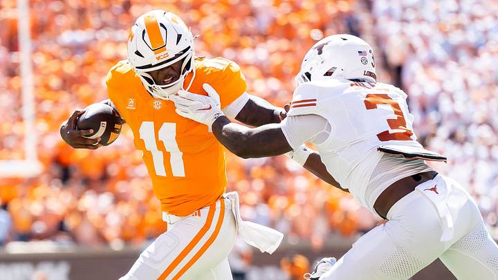 Sep 26, 2026; Knoxville, Tennessee, USA; Tennessee quarterback Faizon Brandon (11) tries to outrun Texas linebacker Rasheem Biles (3) during a college football game between Tennessee and Texas at Neyland Stadium in Knoxville, Tenn. on Sept. 26, 2026. Mandatory Credit: Brianna Paciorka-USA TODAY Network via Imagn Images Sep 26, 2026; Knoxville, Tennessee, USA; Tennessee quarterback Faizon Brandon (11) tries to outrun Texas linebacker Rasheem Biles (3) during a college football game between Tennessee and Texas at Neyland Stadium in Knoxville, Tenn. on Sept. 26, 2026. Mandatory Credit: Brianna Paciorka-USA TODAY Network via Imagn Images