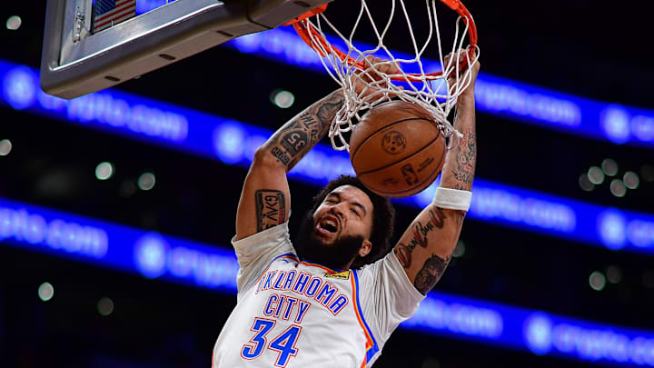 April 7, 2026; Los Angeles, California, USA; Oklahoma City Thunder guard Kenrich Williams (34) dunks for the basket against the Los Angeles Lakers during the second half at Crypto.com Arena. Mandatory Credit: Gary A. Vasquez-Imagn Images